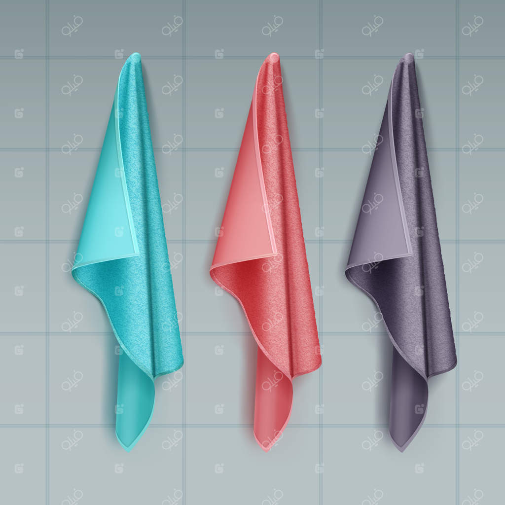 تصویر حوله‌های رنگی از جنس پنبه یا حوله‌ای آویخته شده بر دیوار کاشی‌کاری شده