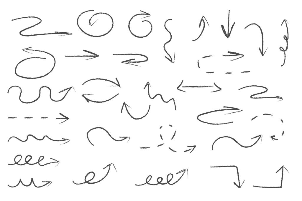 طرح‌های زغالی یا مداد شمعی روی زمینه سفید؛ نقاشی دست‌ساز.