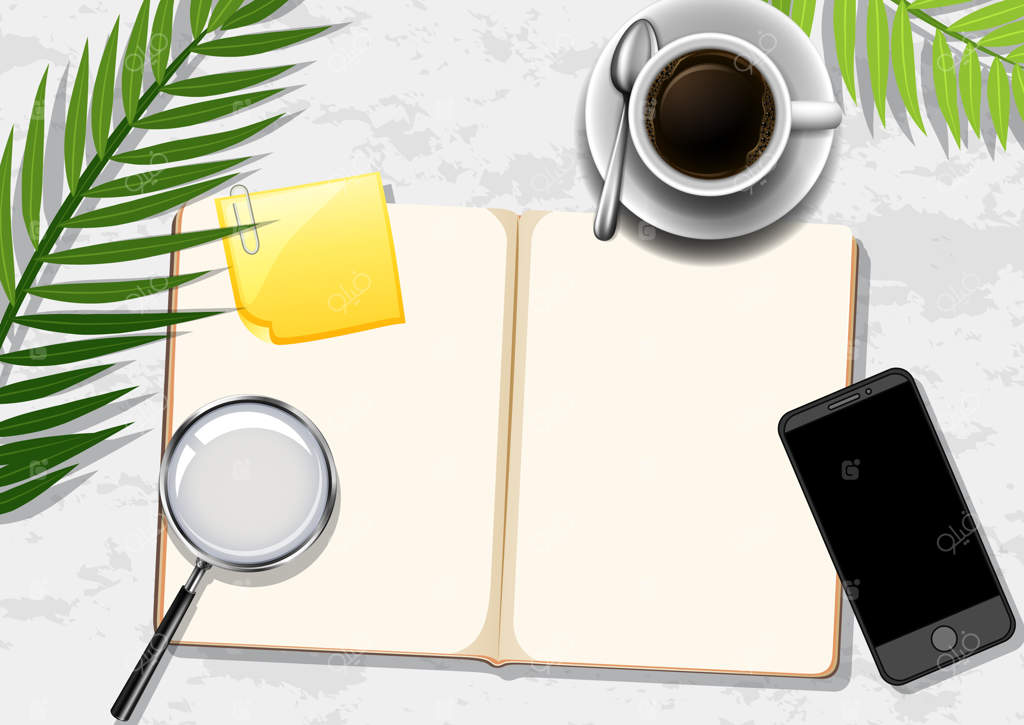 نمای بالا میز کار اداری با عناصر مختلف و برگ‌های سبز